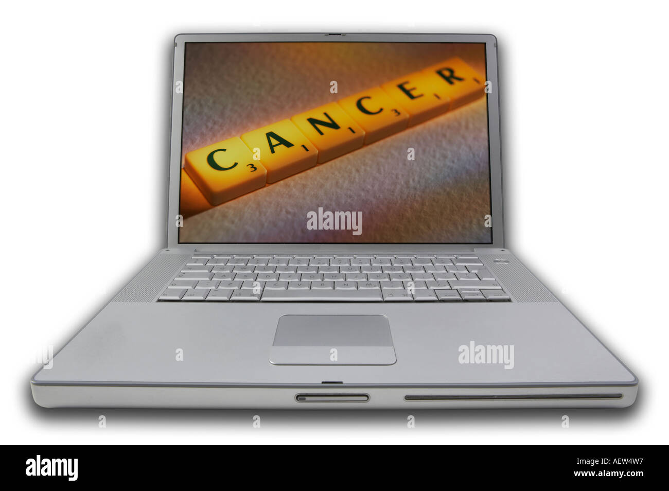 LAP TOP COMPUTER WITH SCRABBLE LETTERS ON SCREEN SPELLING WORDS CANCER