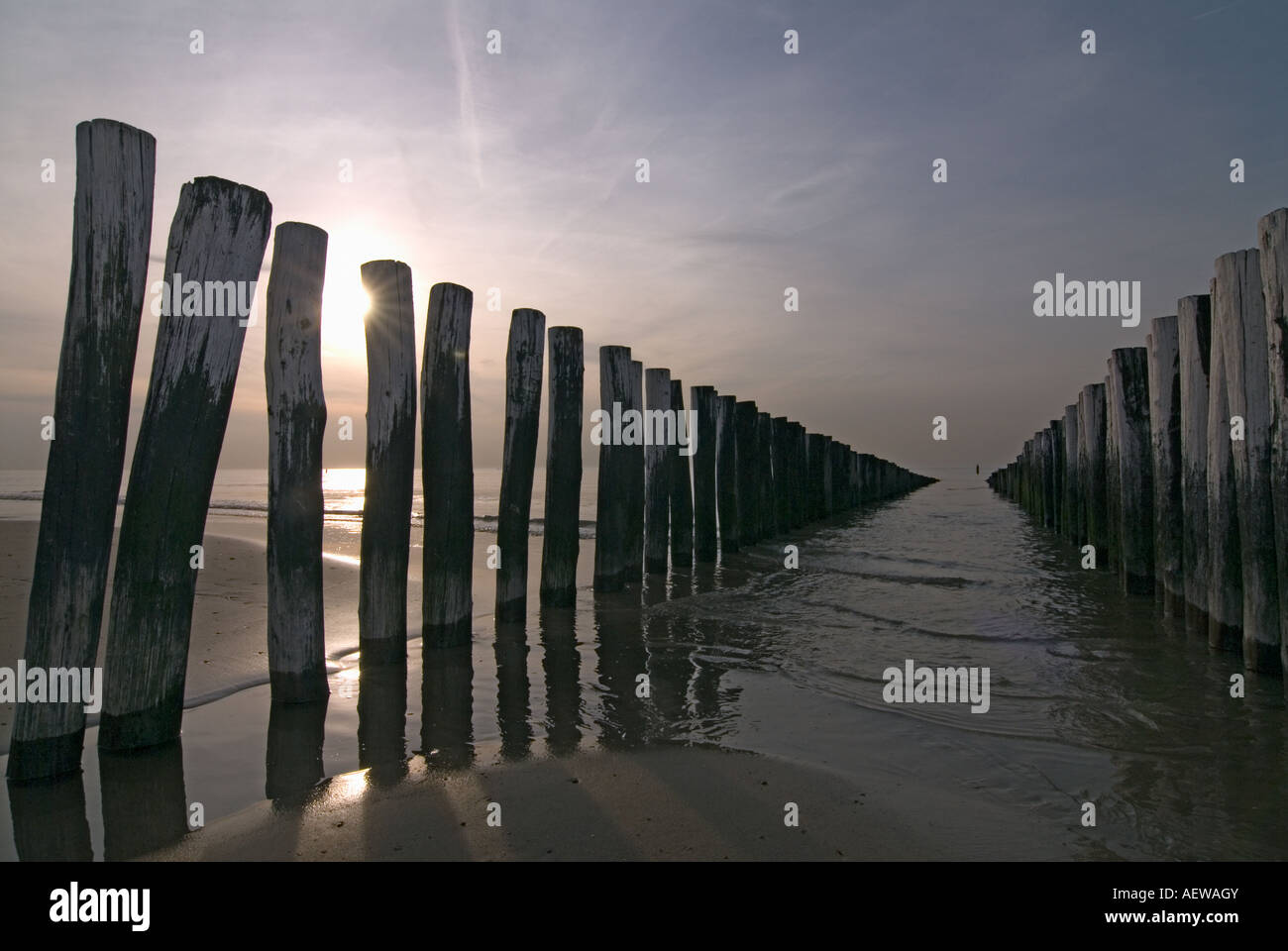 Breakers on the beach of Domburg Netherlands by a sunset Stock Photo