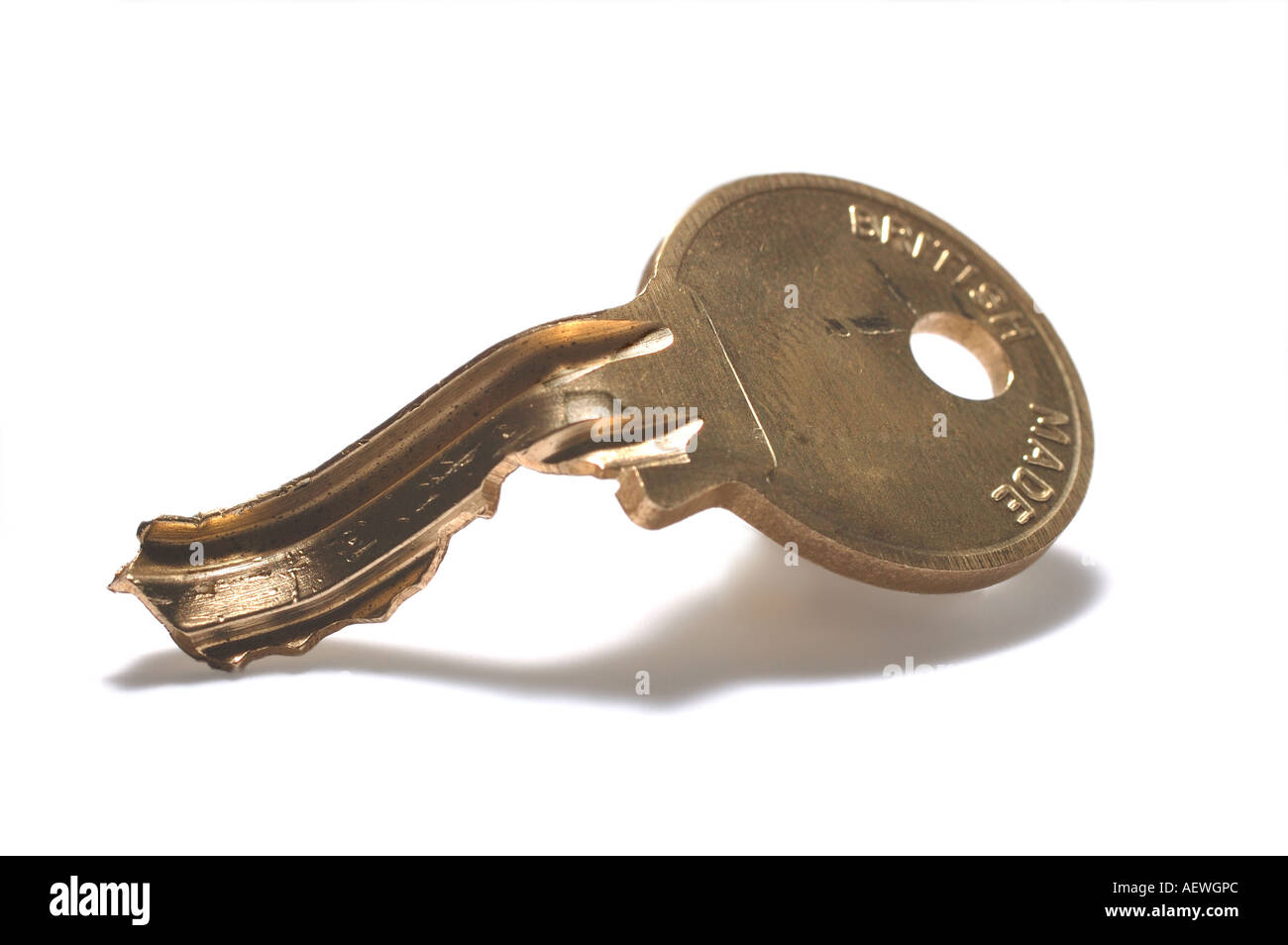 Bent yale key on white background Stock Photo Alamy