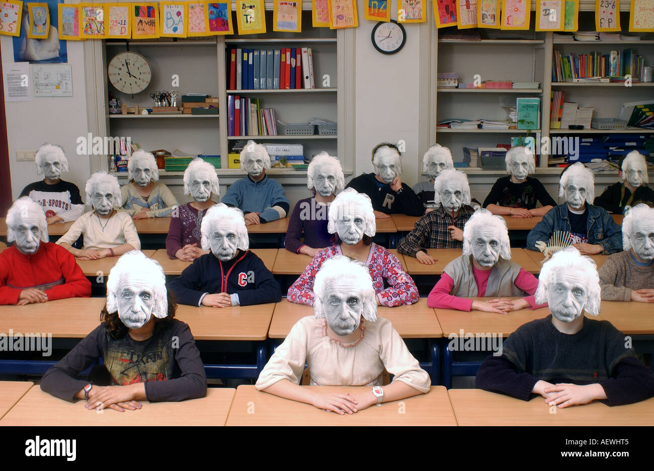 Classroom with young einstein masked kids Stock Photo