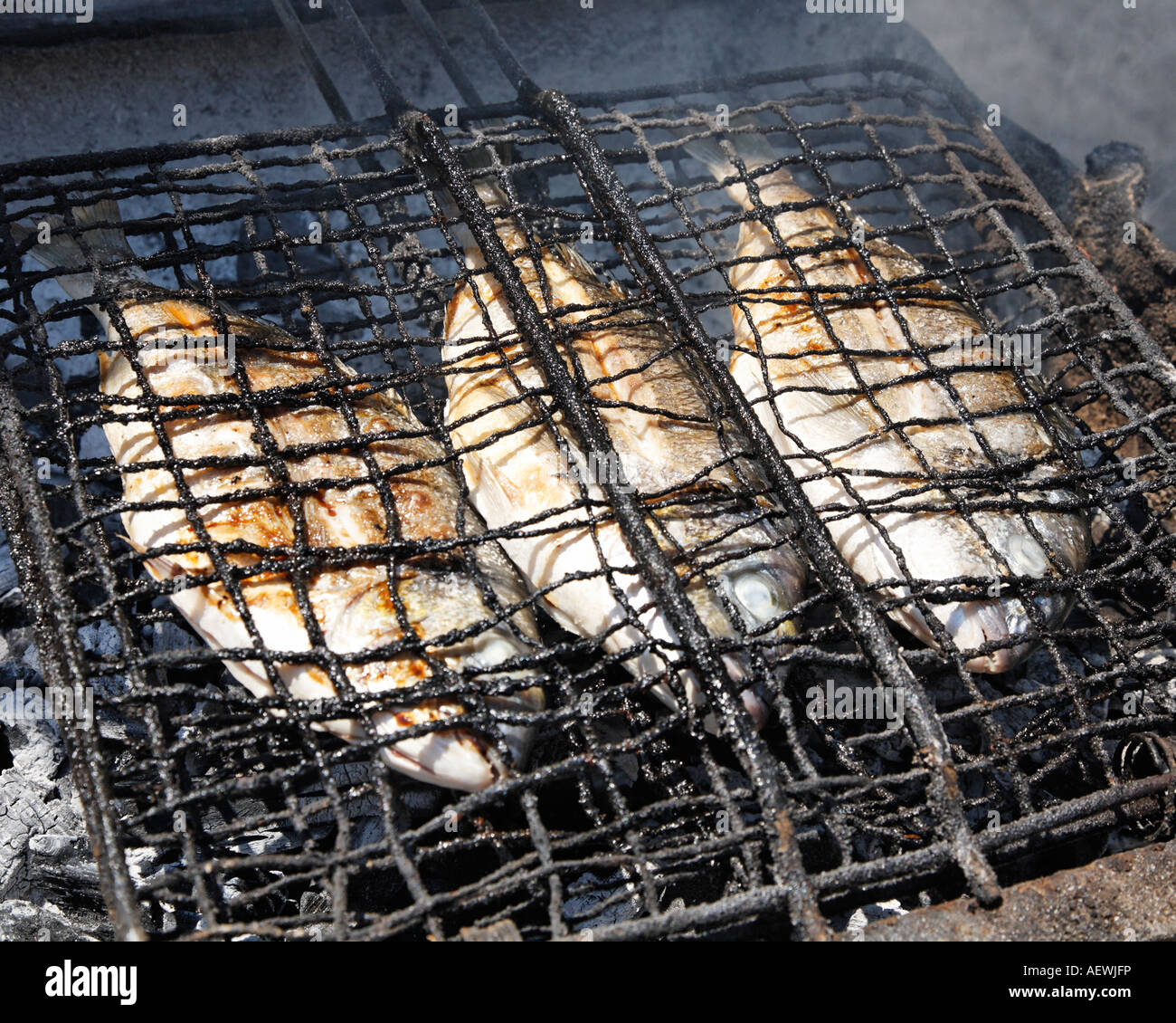 Grilling Fish In Outside Taverna Genadi Rhodes Greek Islands Greece Hellas  Stock Photo - Alamy
