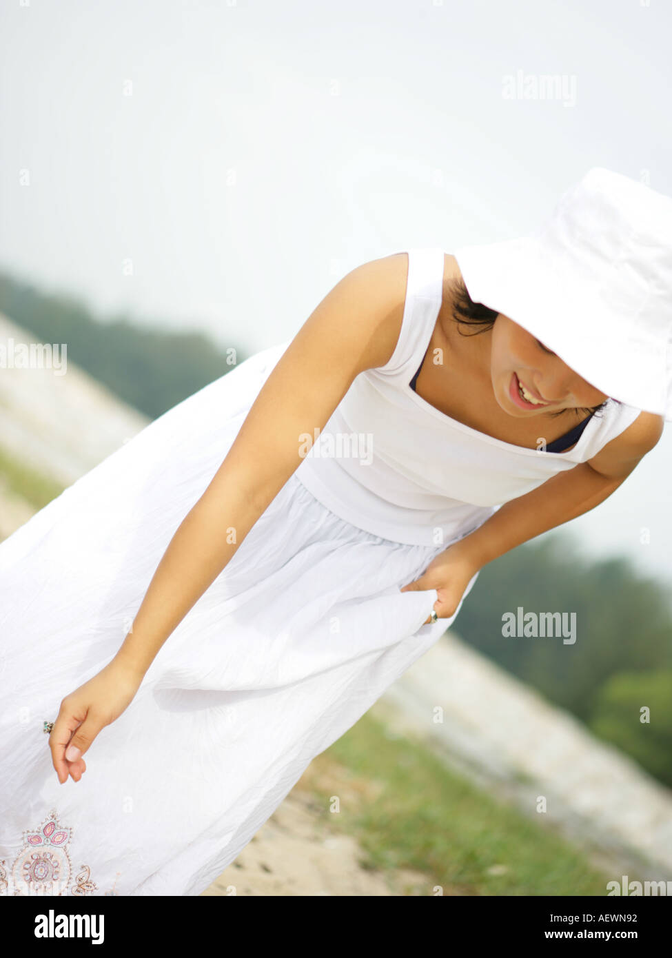 Young woman bending on the beach Stock Photo Alamy