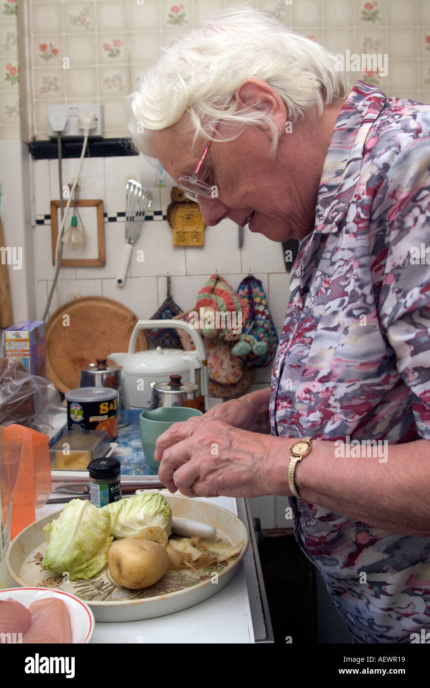 Carer supporting elderly person at home