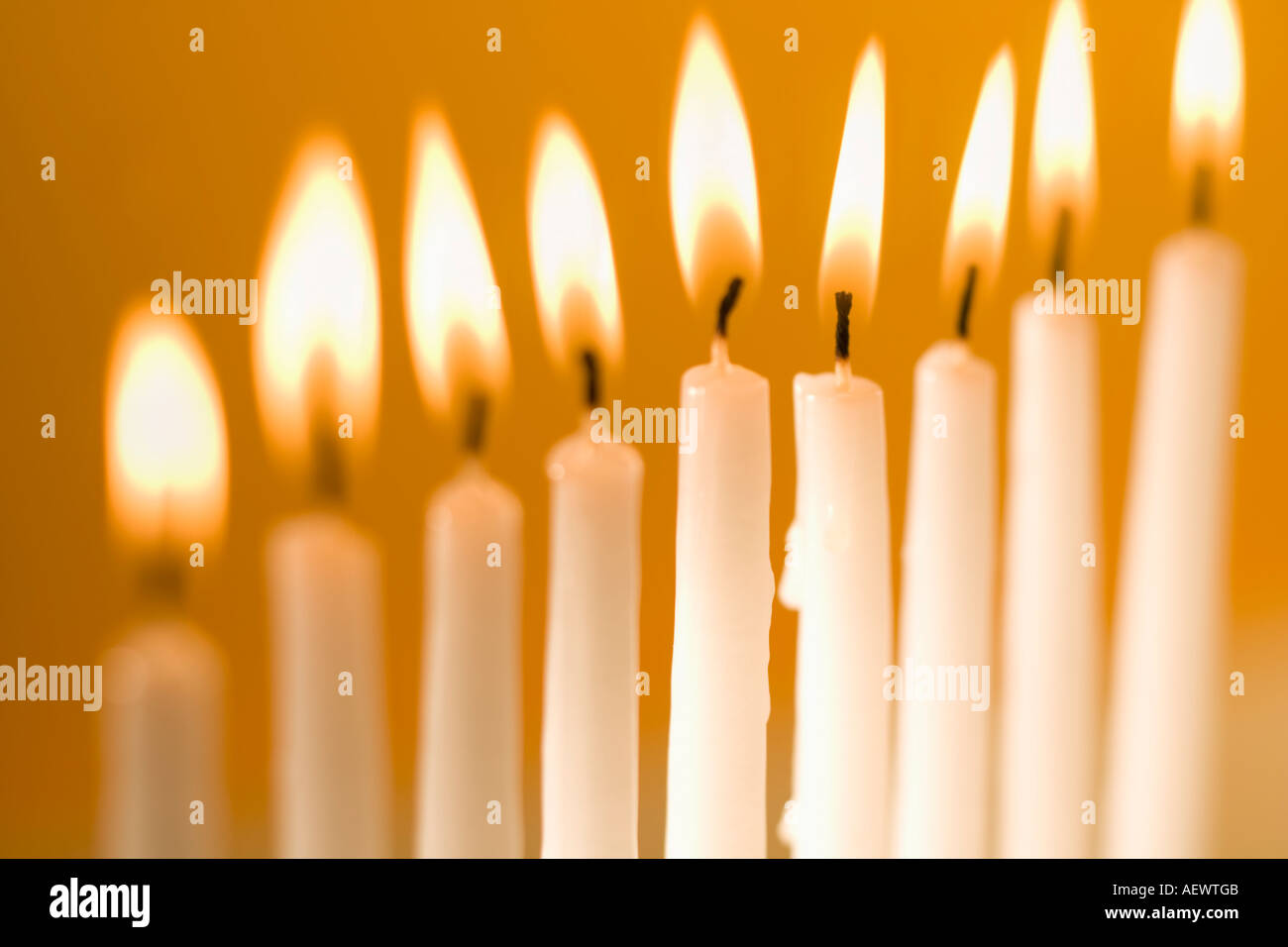 Candles burning in a menorah Stock Photo Alamy