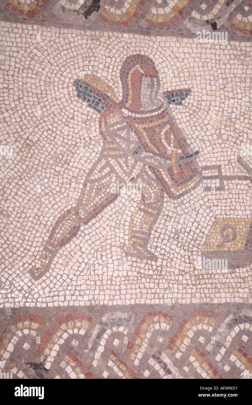 Mosaic depicting Roman Gladiator with shield and sword and wearing helmet. Located at Bignor Roman Villa, West Sussex, England Stock Photo