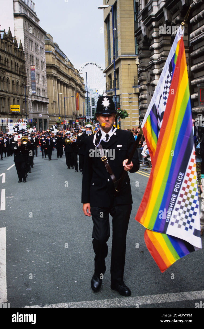 Flag Bearing Policeman At Gay Pride Manchester Stock Photo