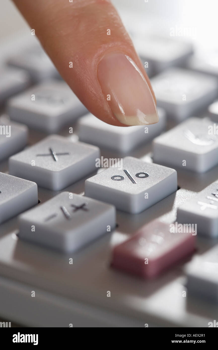 Woman using a calculator Stock Photo