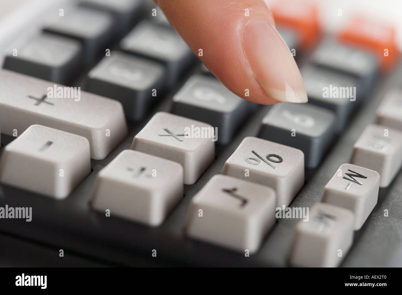 Woman using a calculator Stock Photo