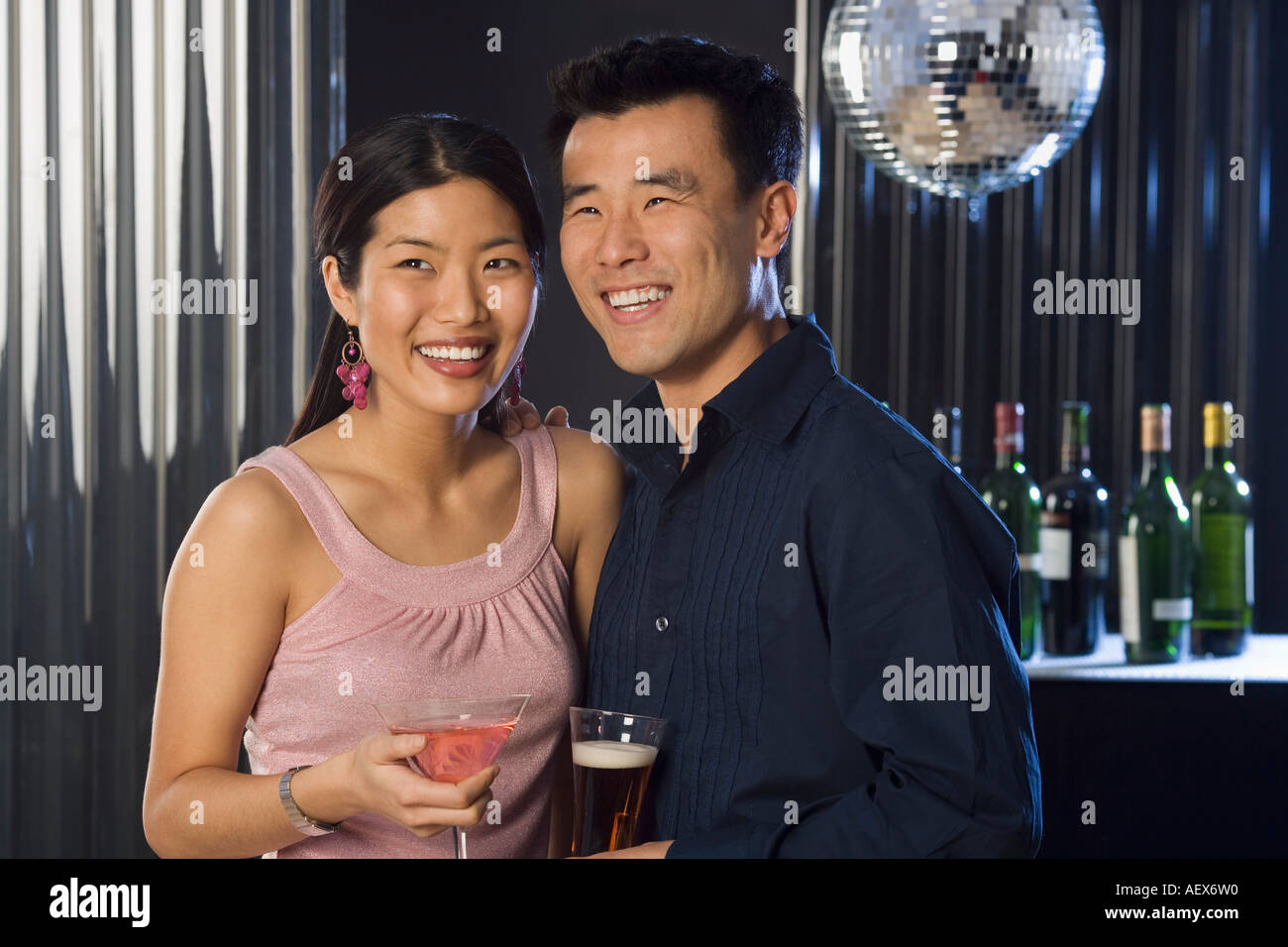 Couple having drinks in a bar Stock Photo