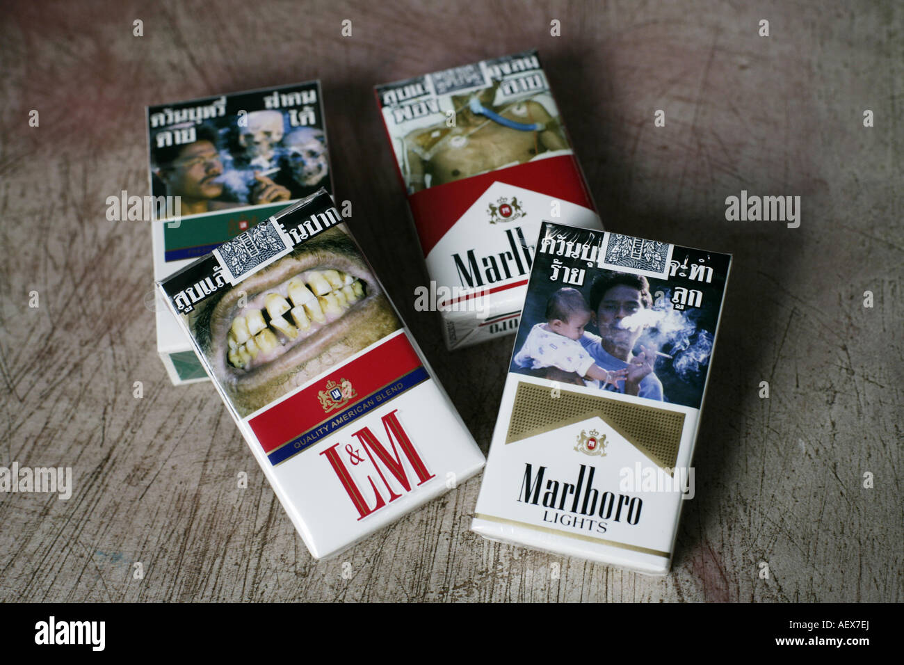 packages of cigarettes with pictures of dead people, ill, cancer Stock Photo