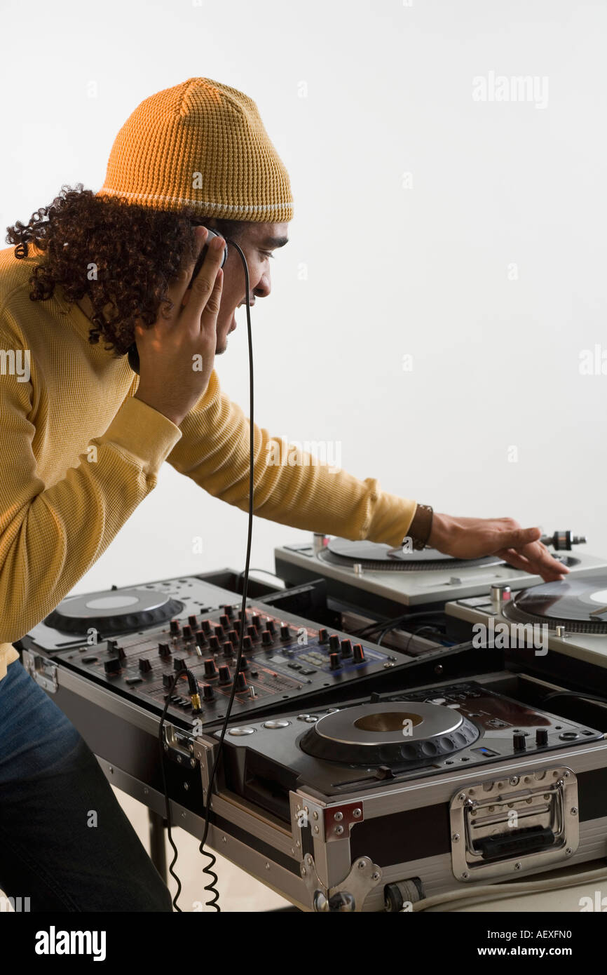 DJ working at music mixing board Stock Photo Alamy