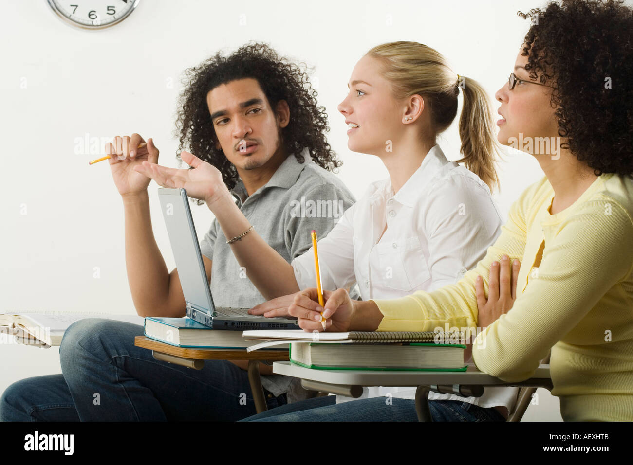 Three college students in class Stock Photo