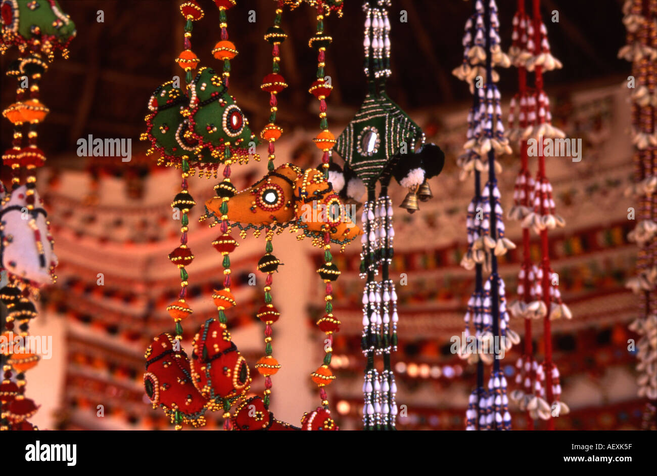 Traditional Locally Produced Handicrafts For Sale Beads Rope Hangings Bright Vibrant Colour Shilpgram Rajasthan India Traditional Locally Produced Handicrafts For Sale Beads Rope Hangings Bright Vibrant Colour Shilpgram Rajasthan India