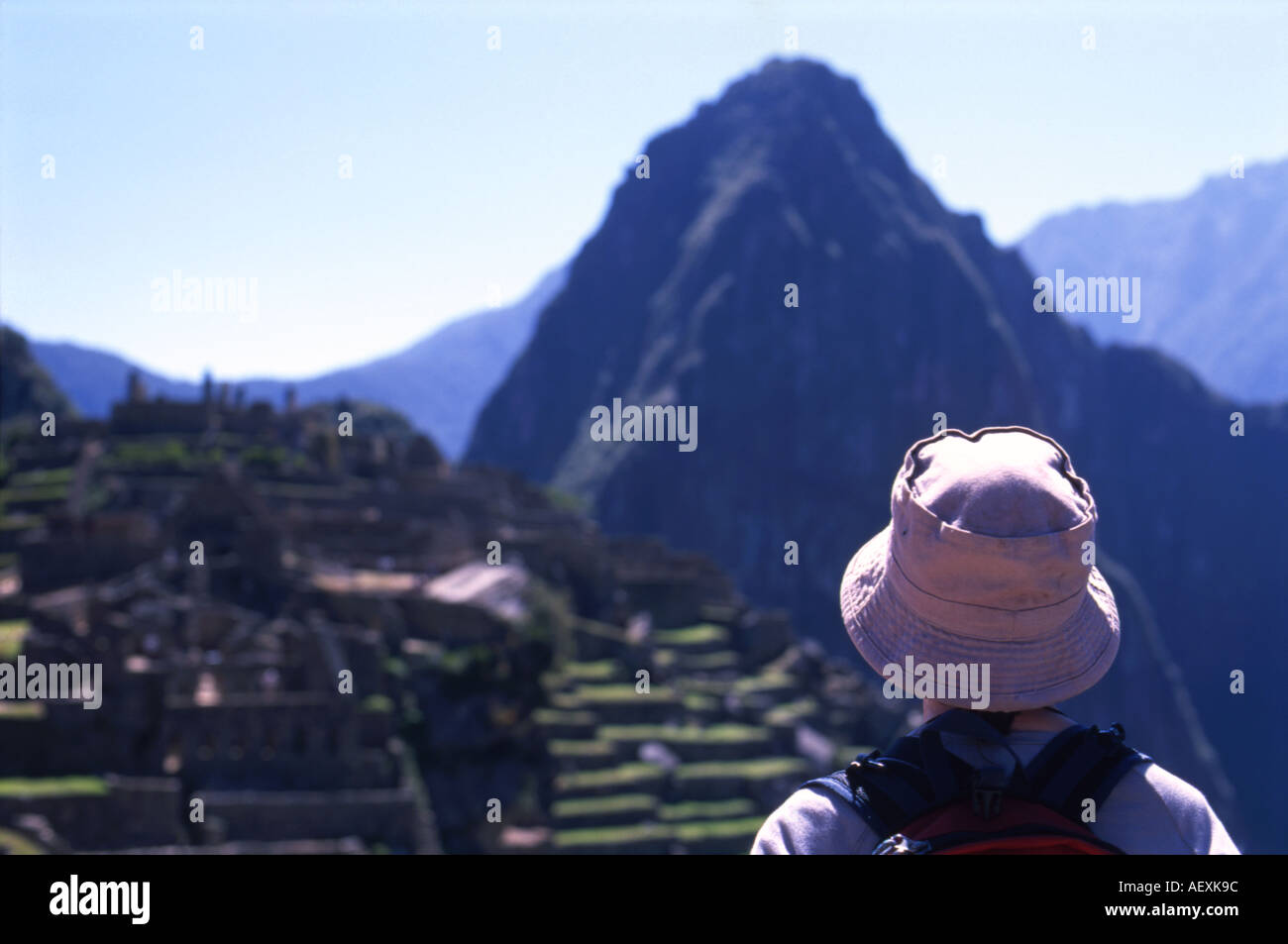 Female tourist in hat looking over Machu Picchu Peru Stock Photo - Alamy