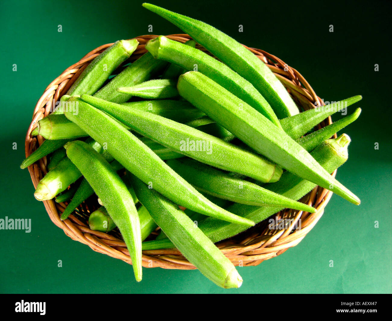 Okra Ladies Fingers Vegetable Studio Table Top On Green Background Stock Photo Alamy