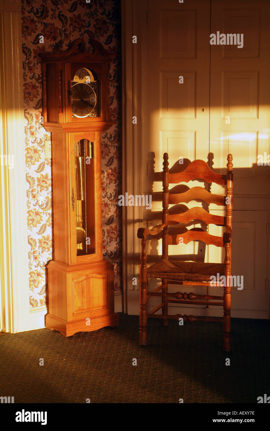 Antique Chair and Clock in an old Mansion Stock Photo