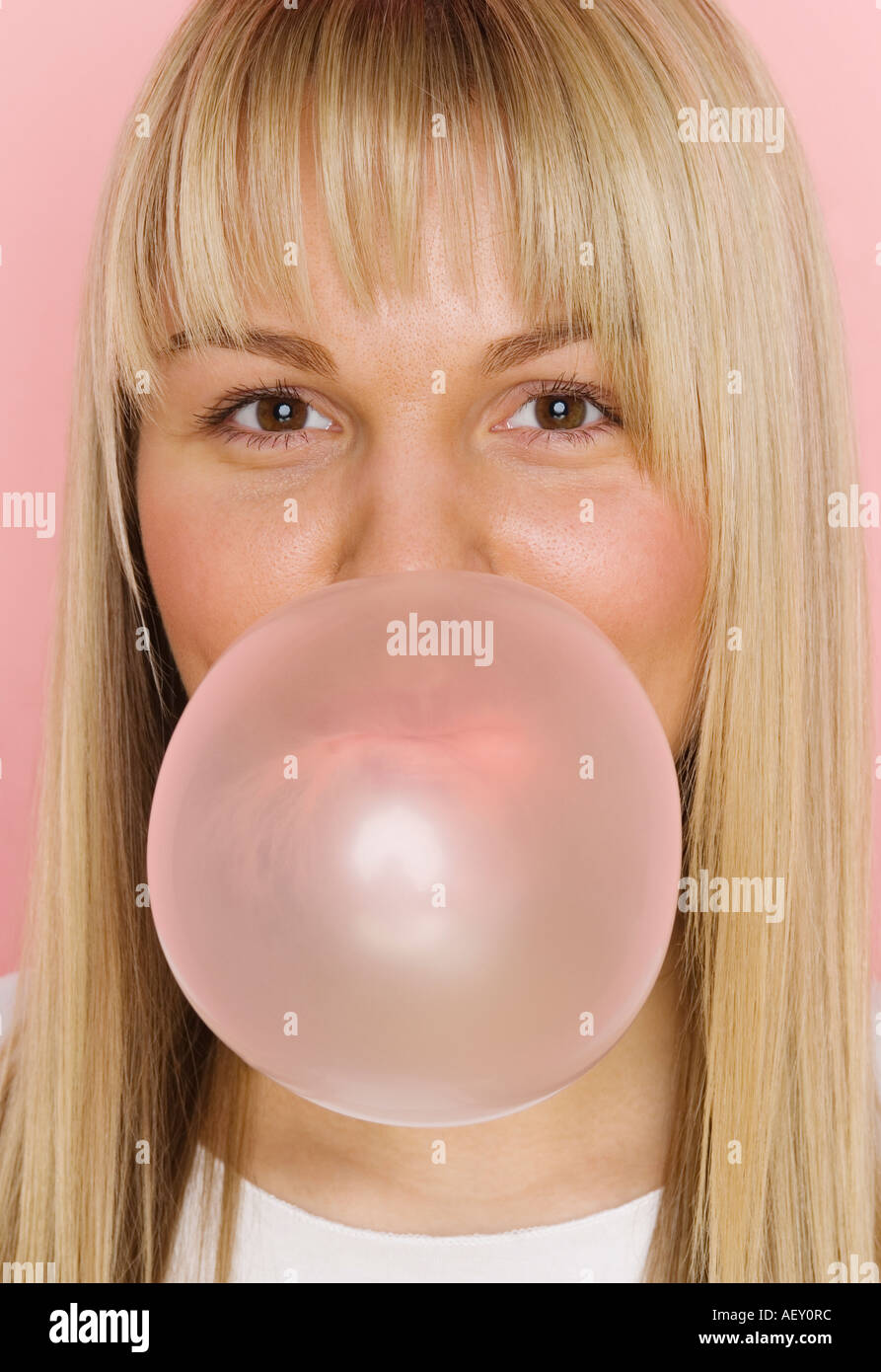 Woman blowing up bubble gum hi-res stock photography and images - Alamy