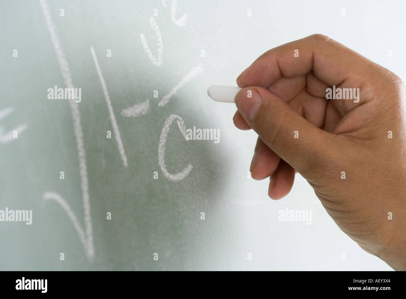 Close up of blackboard with math equations being written on it Stock Photo