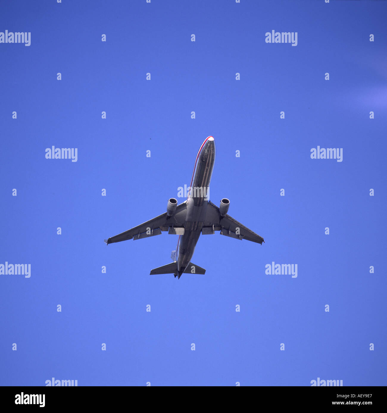 American Airlines aircraft in flight from below with flaps down Stock Photo