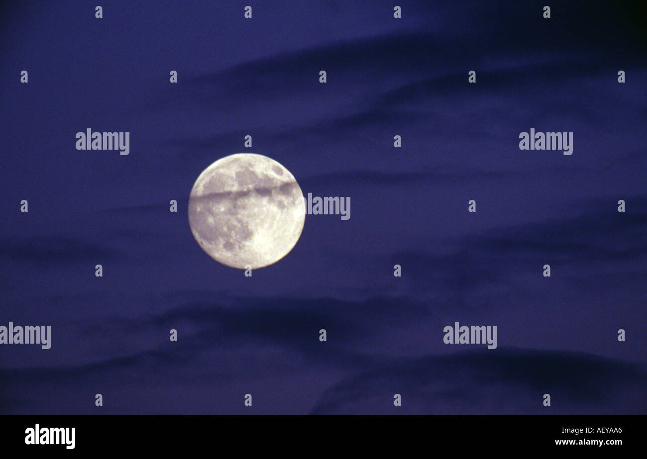 Full Moon with black clouds Stock Photo