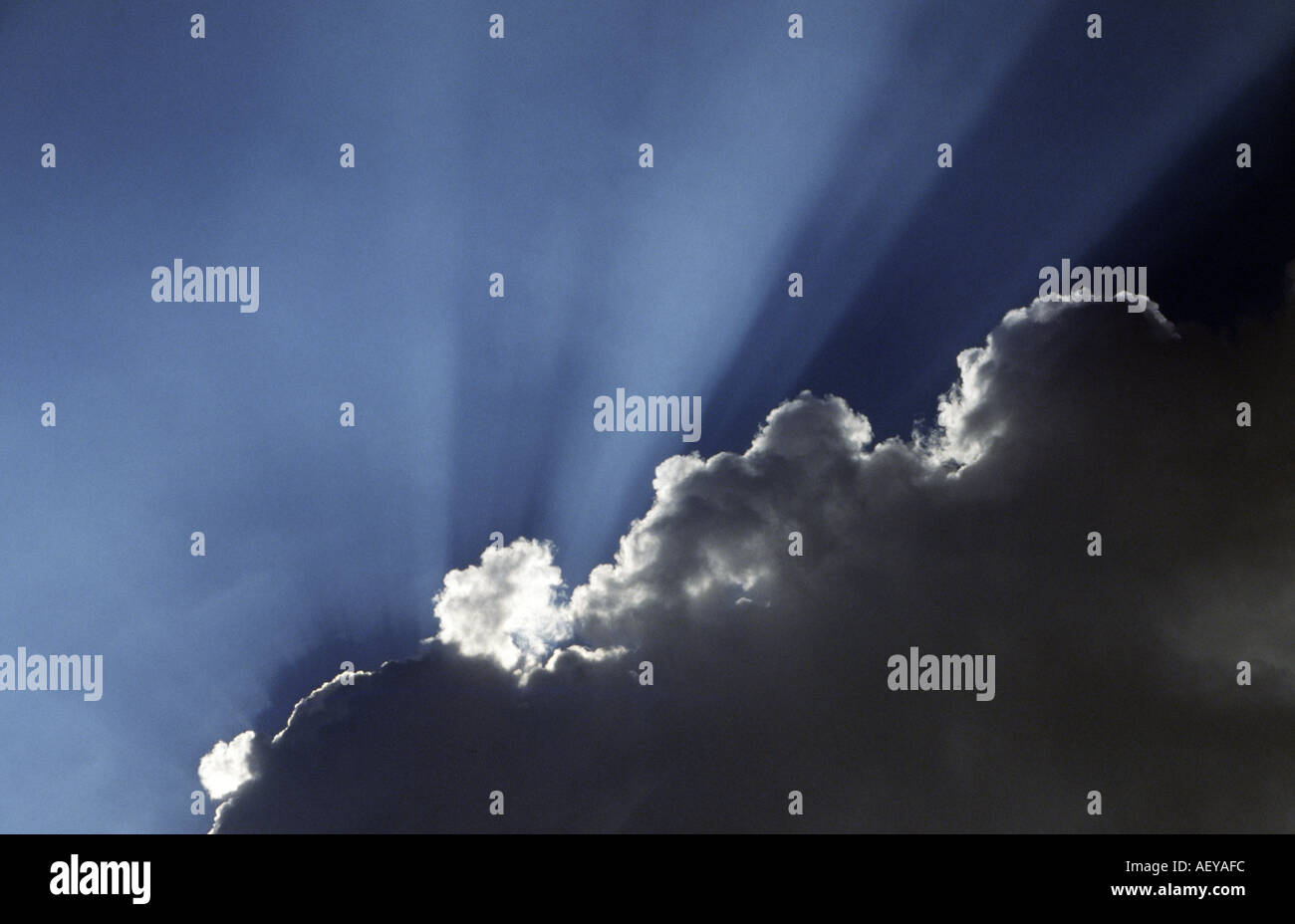 Sunrays from behind clouds hi-res stock photography and images - Alamy