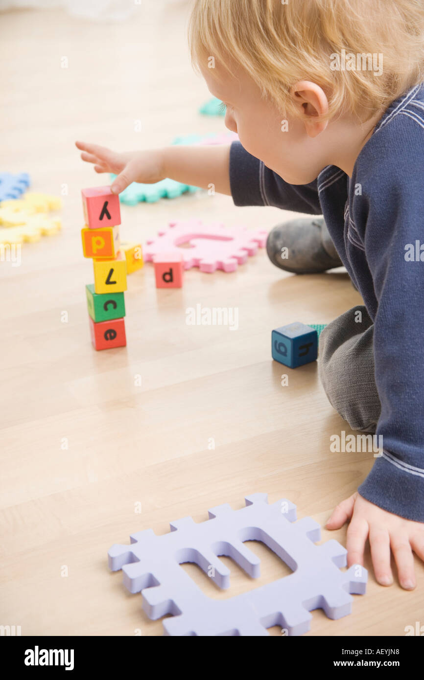 Toddler stacking blocks Stock Photo Alamy
