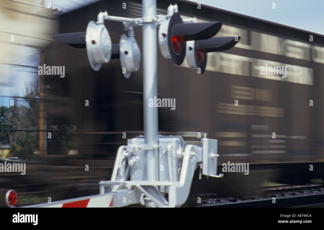freight train motion blur at railroad crossing Stock Photo