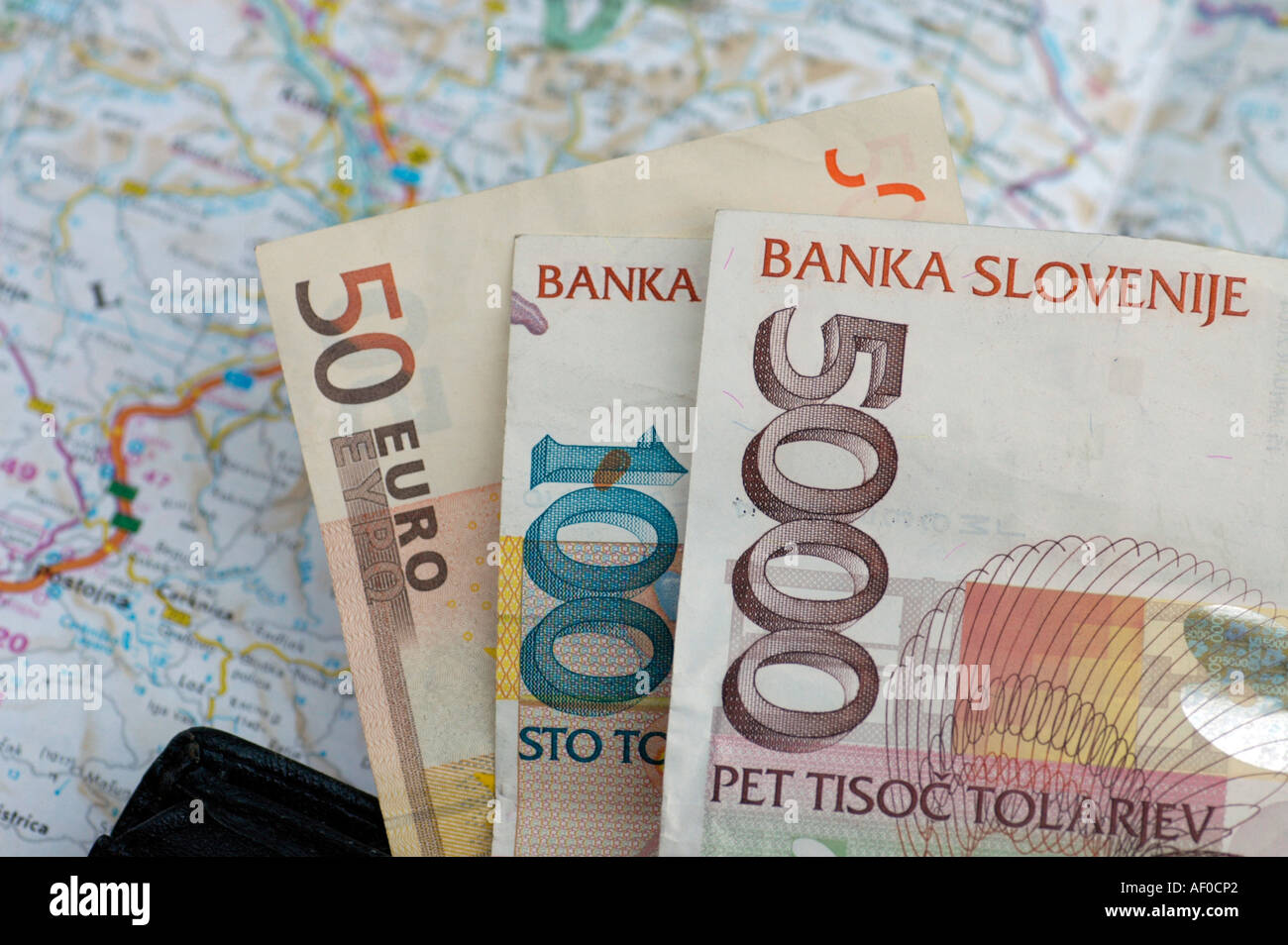 introduction of the euro changeover to the euro slovenian money currency Tollar and euro in a purse Stock Photo