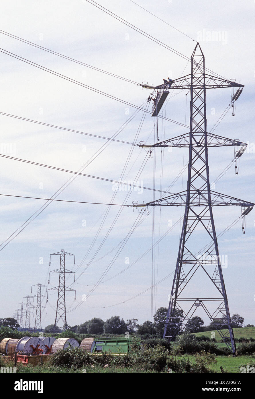 Repairing Live Power Cables on Pylon Stock Photo - Alamy