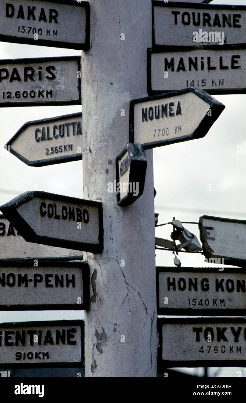 French concrete signpost in Vietnam with distances to places of importance to the empire. Stock Photo