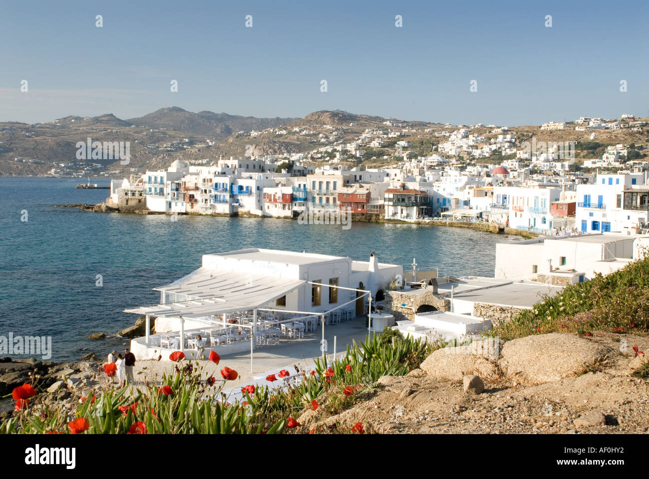 A Taverna featured in the final sequence of 'The Bourne Identity' movie, located just below the famous windmills of Mykonos Town Stock Photo