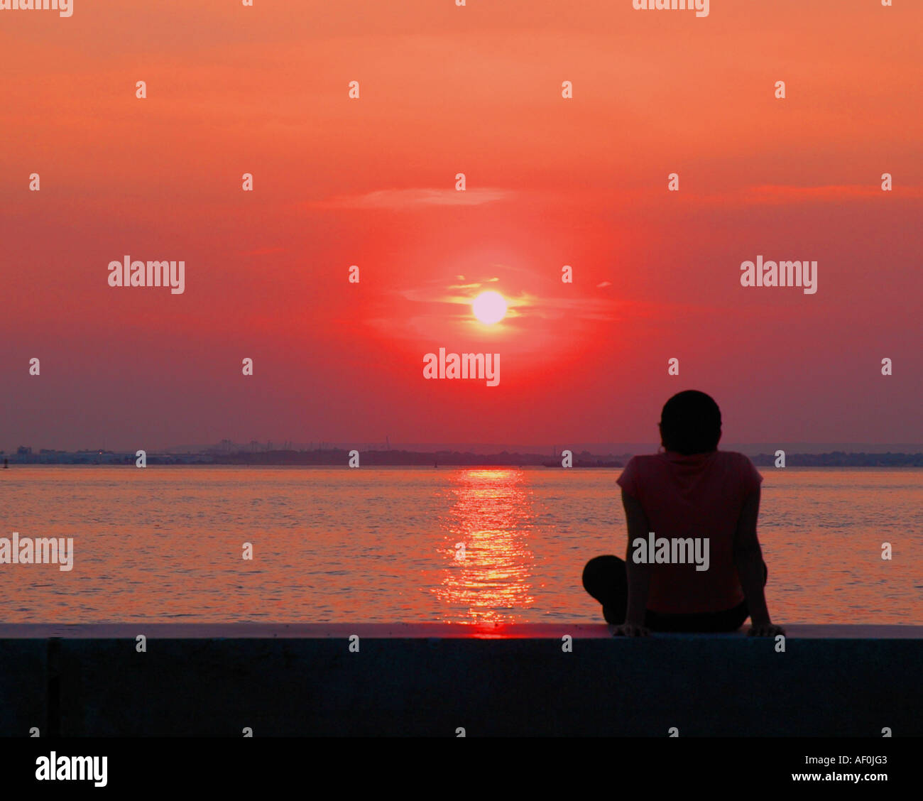 silhouette of woman Watching The Sunset Stock Photo - Alamy