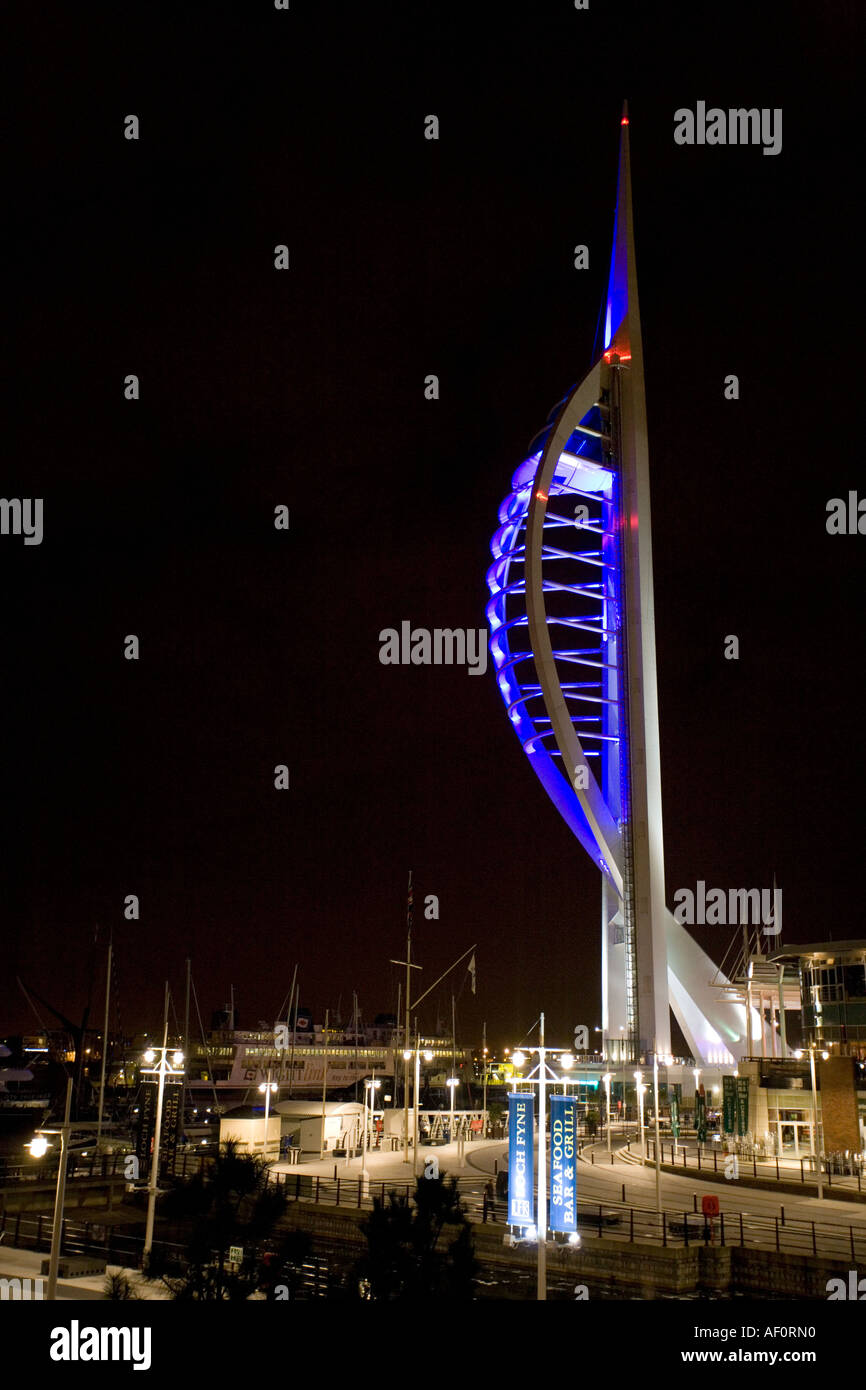 Spinaker Tower lit in blue at Gunwharf Quay at night Portsmouth Harbor Portsmouth England UK Stock Photo