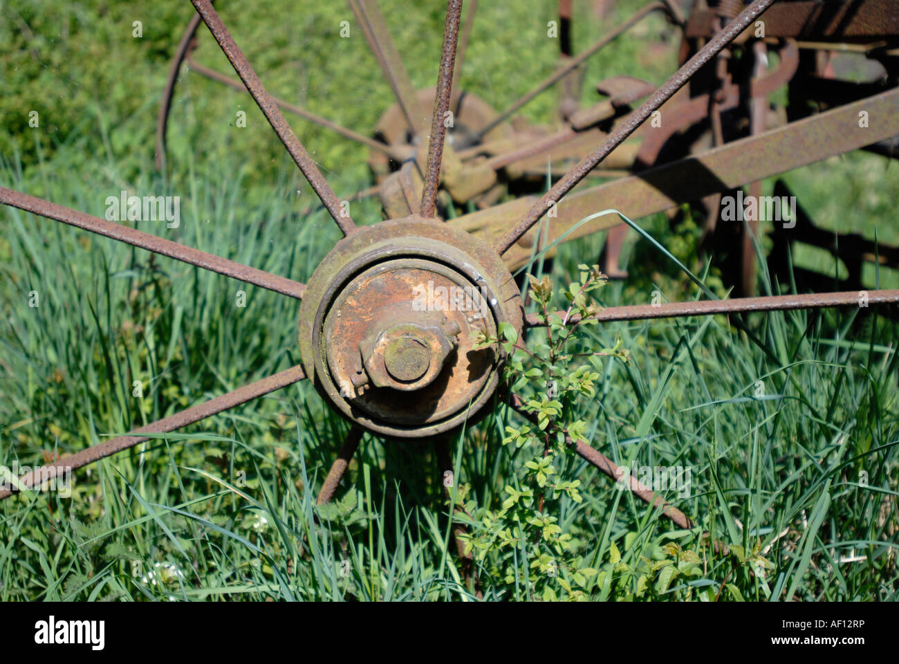Rusting agricultural farm equipment seed drill Union farm Gressenhall