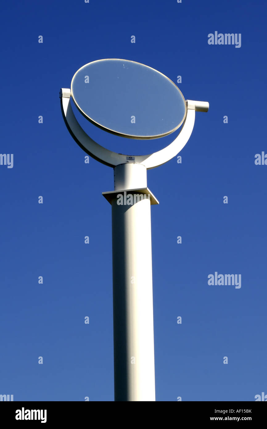 Rotating mirror to capture sunlight and reflect it to solar panels Stock Photo