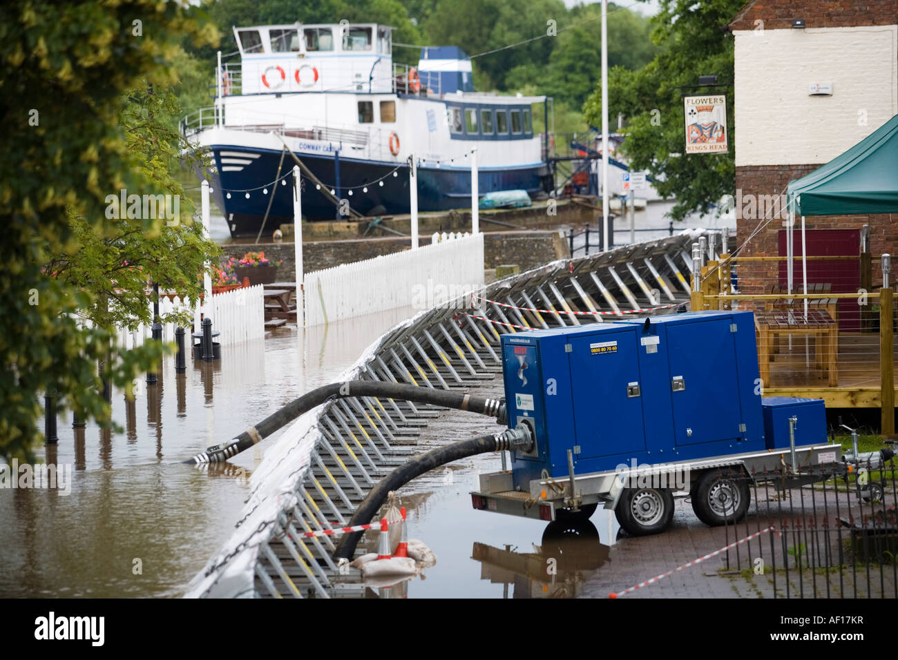 Emergency flood barriers and water pump erected at Upton on Severn
