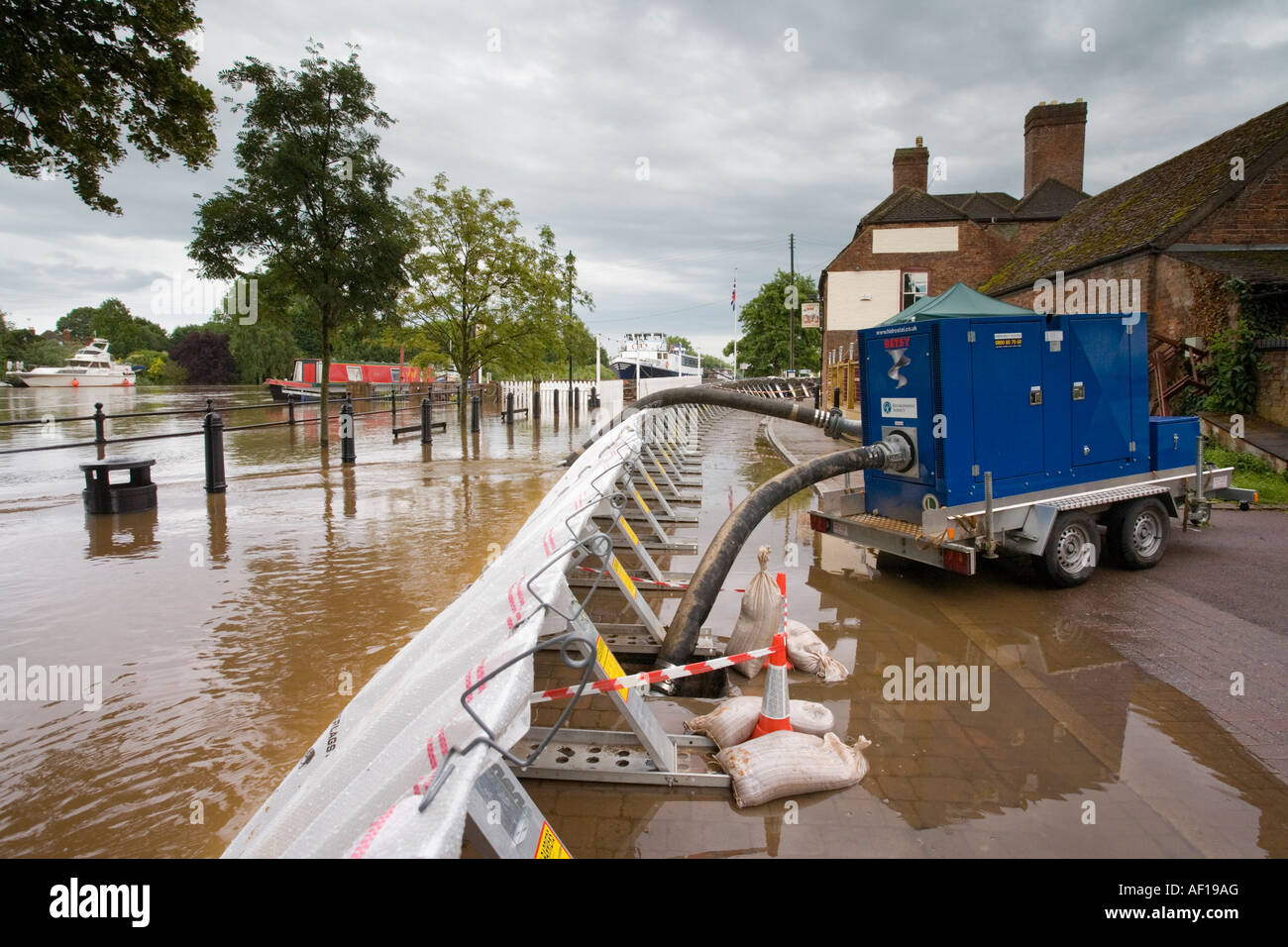 Emergency flood barriers and water pump erected at Upton on Severn