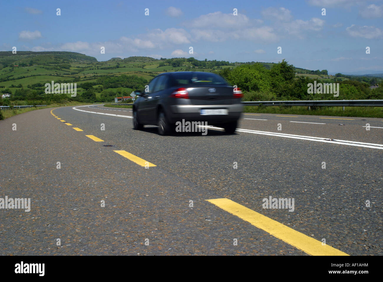 Speeding car on an Irish Road Stock Photo Alamy