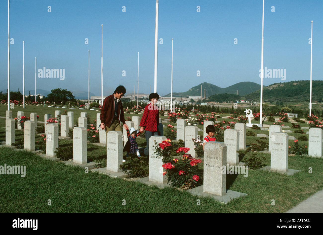 Korea, A local family pay respects to Allied war graves of the 1950-1953 war. Stock Photo