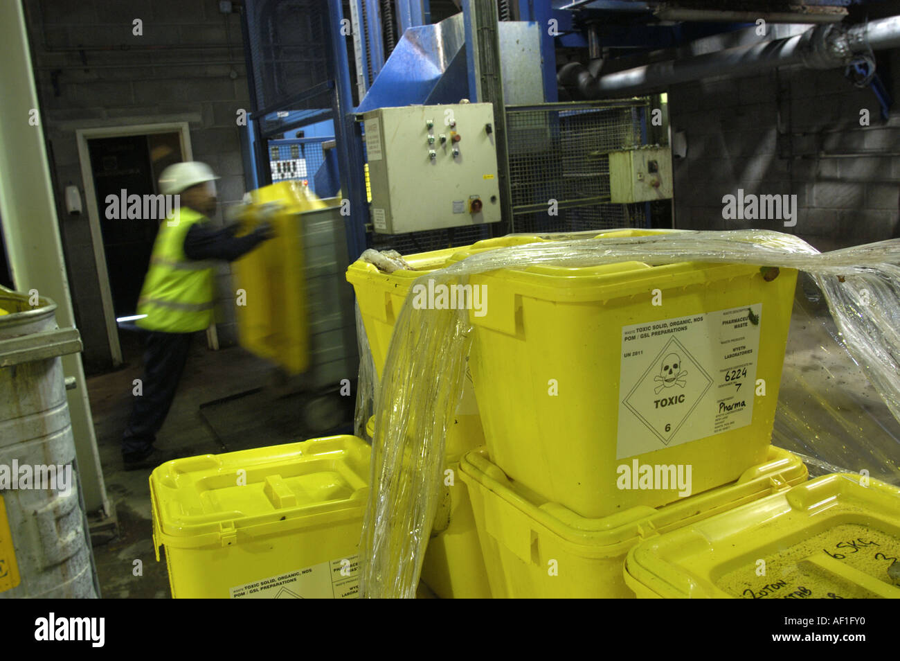 Loading toxic waste into bins prior to entering the gasification plant