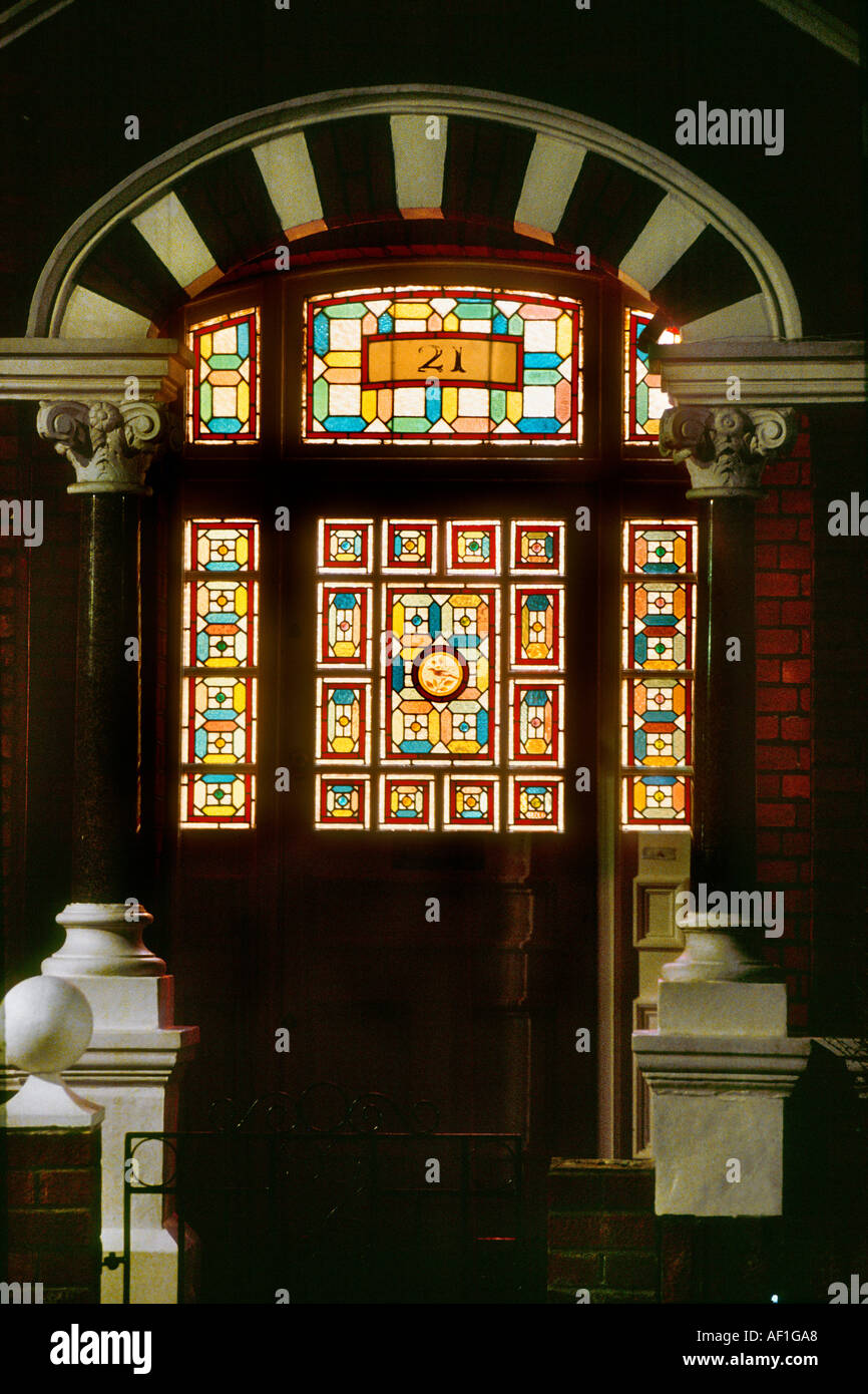 Victorian Stained Glass front door at night British Housing London