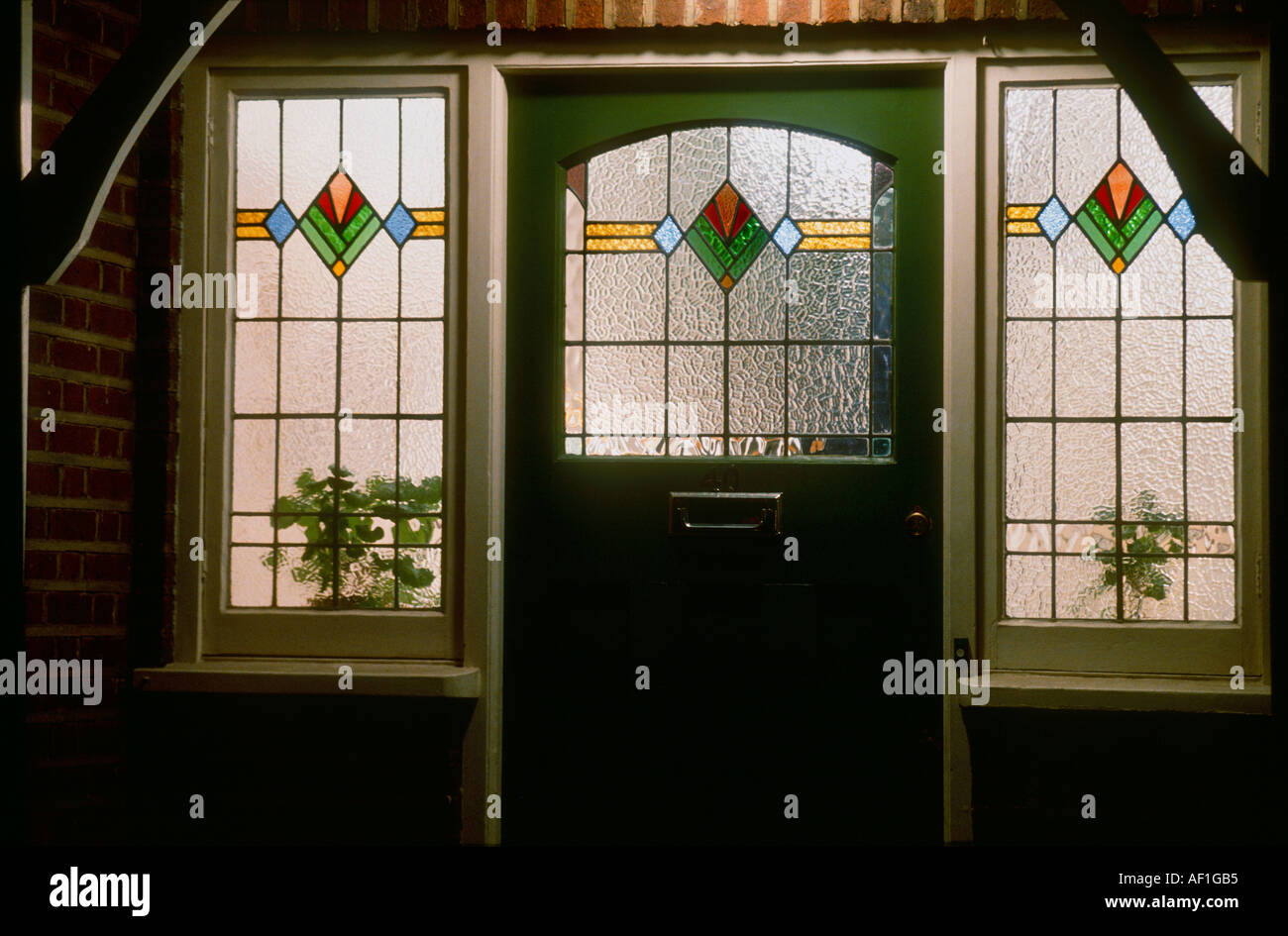 Art Deco Stained Glass Front Door At Night British Housing London Stock Photo Alamy