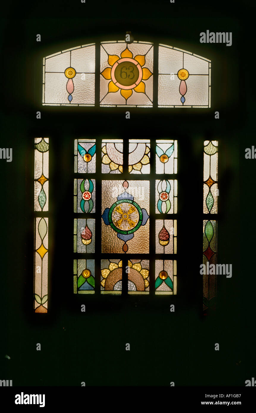 Stained Glass front door at night British Housing London Stock Photo