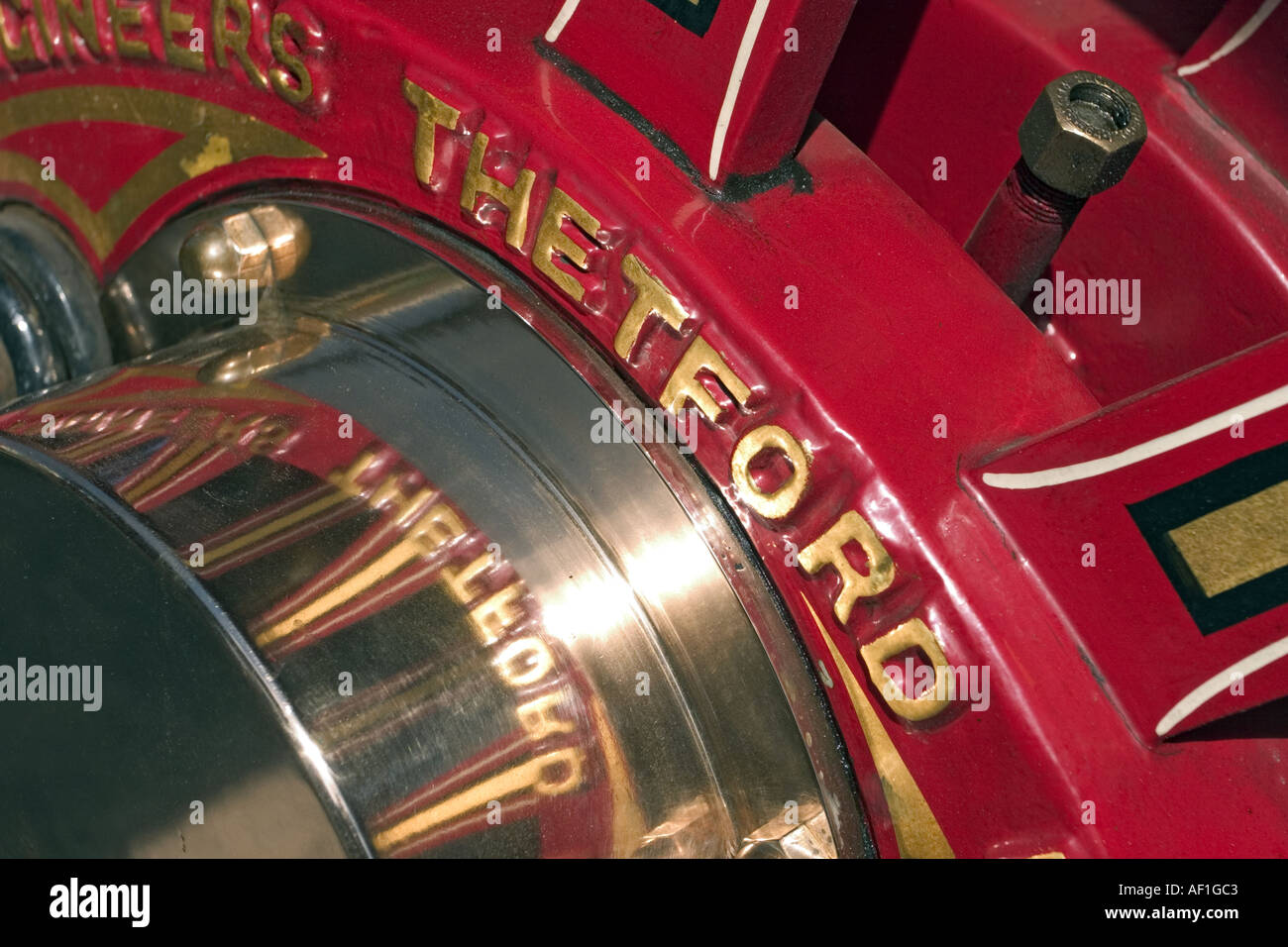 Close up of polished brass wheel bearing on vintage steam traction engine circa 1930 showing Thetford England markings Stock Photo