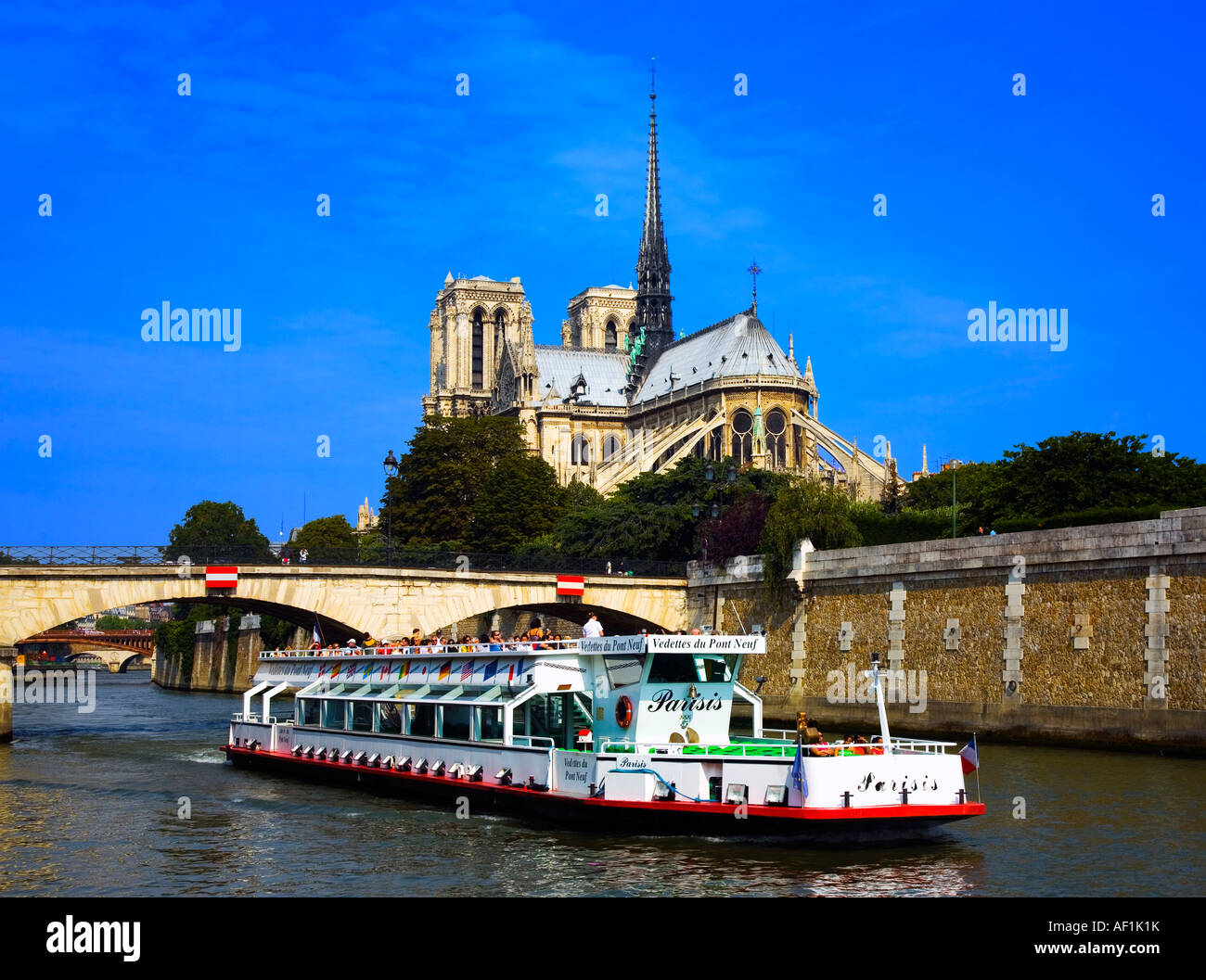 View of Notre Dame with boat in foreground Paris Stock Photo