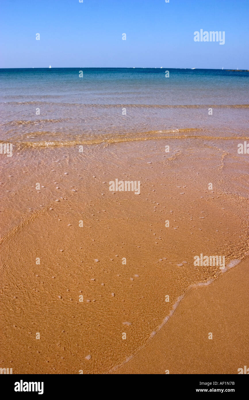 waves over sand in french beach Stock Photo Alamy