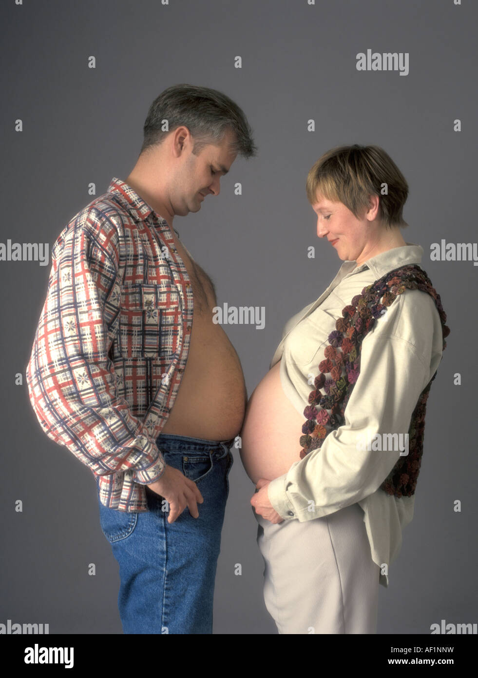 Comparing two bellies Stock Photo