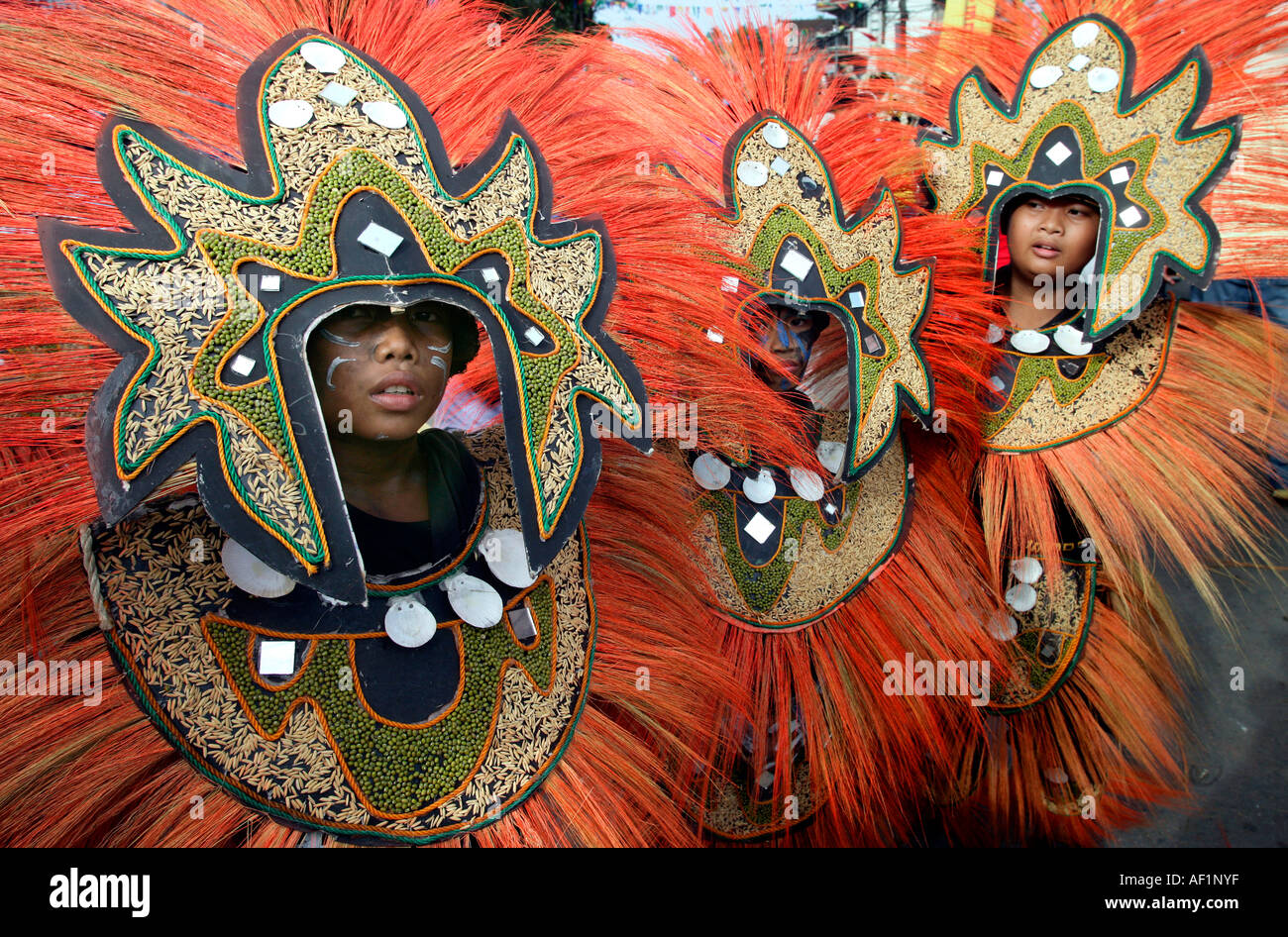 boys with headdress at the Ati Atihan festival, carnival festival on the streets of the island capital Kalibo, Philippines Stock Photo