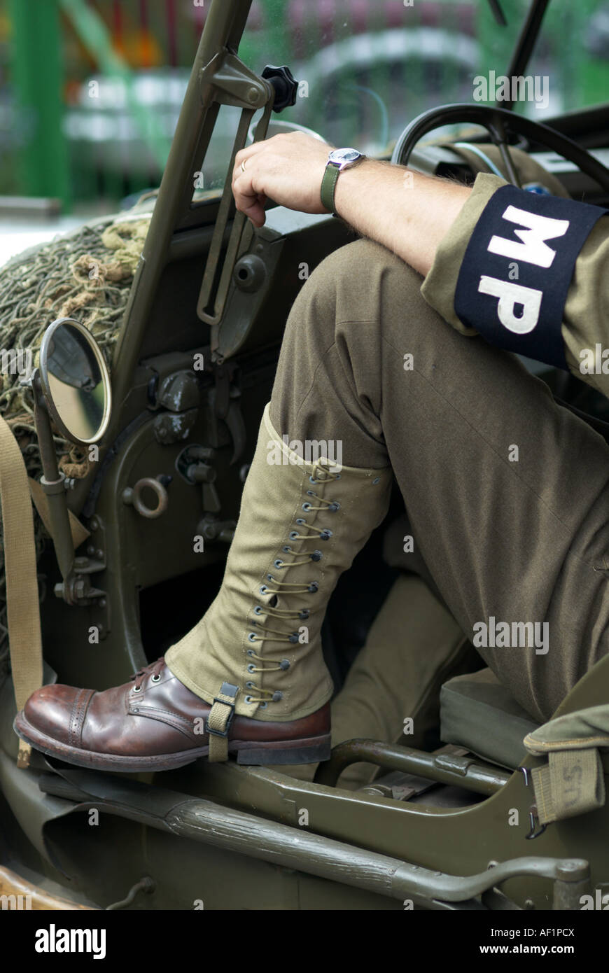 Closeup of US military police in jeep showing armband and clothes circa 1943 Stock Photo