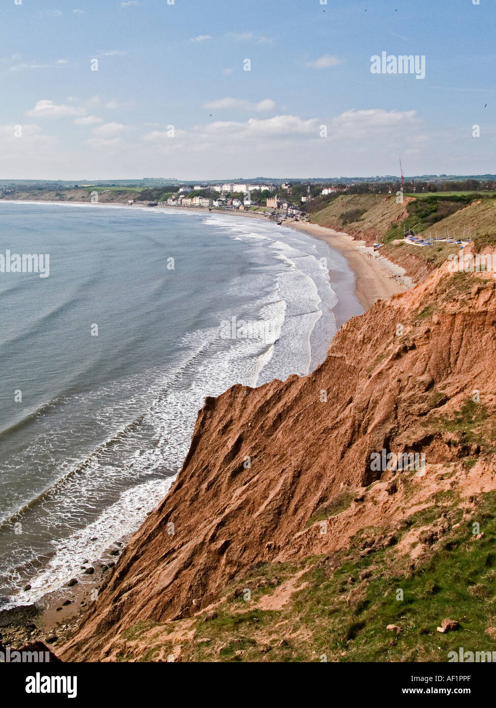 Eroded cliffs at Filey, North Yorkshire, UK, looking from the Filey Brigg headland towards the town. Stock Photo
